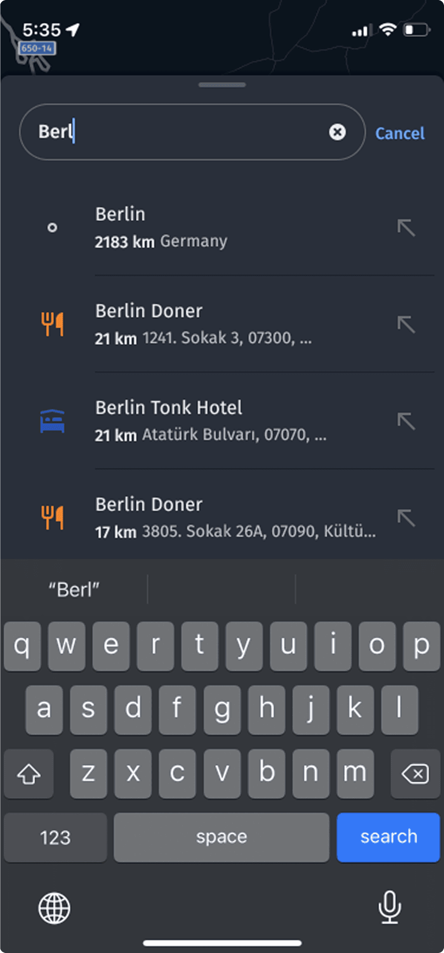 Mobile search: the partial query 'Berl' with autosuggest results for Berlin and nearby places, each row carrying a category icon and a distance, above the keyboard.